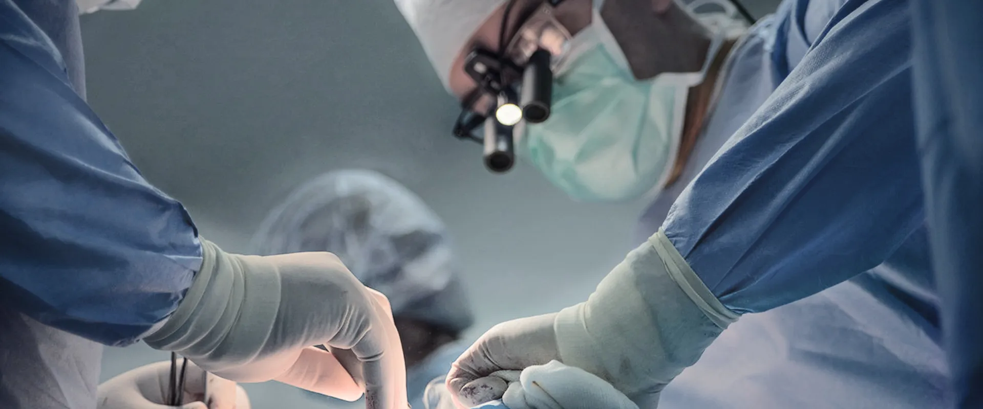 Doctors working in a treatment or operating room.