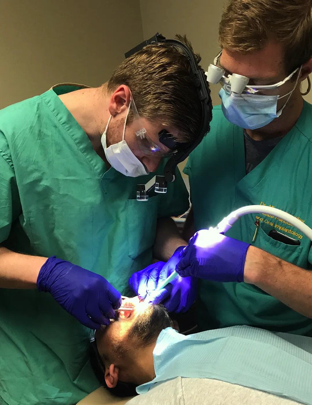 Dentist working in a treatment or operating room.