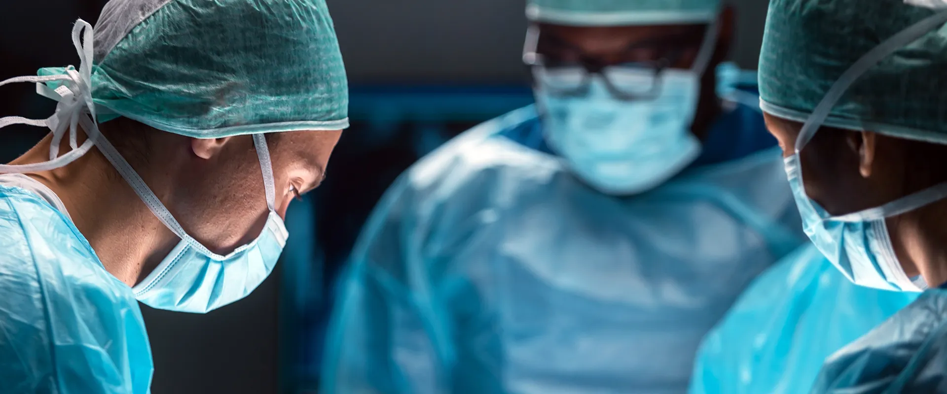 Doctors working in a treatment or operating room.