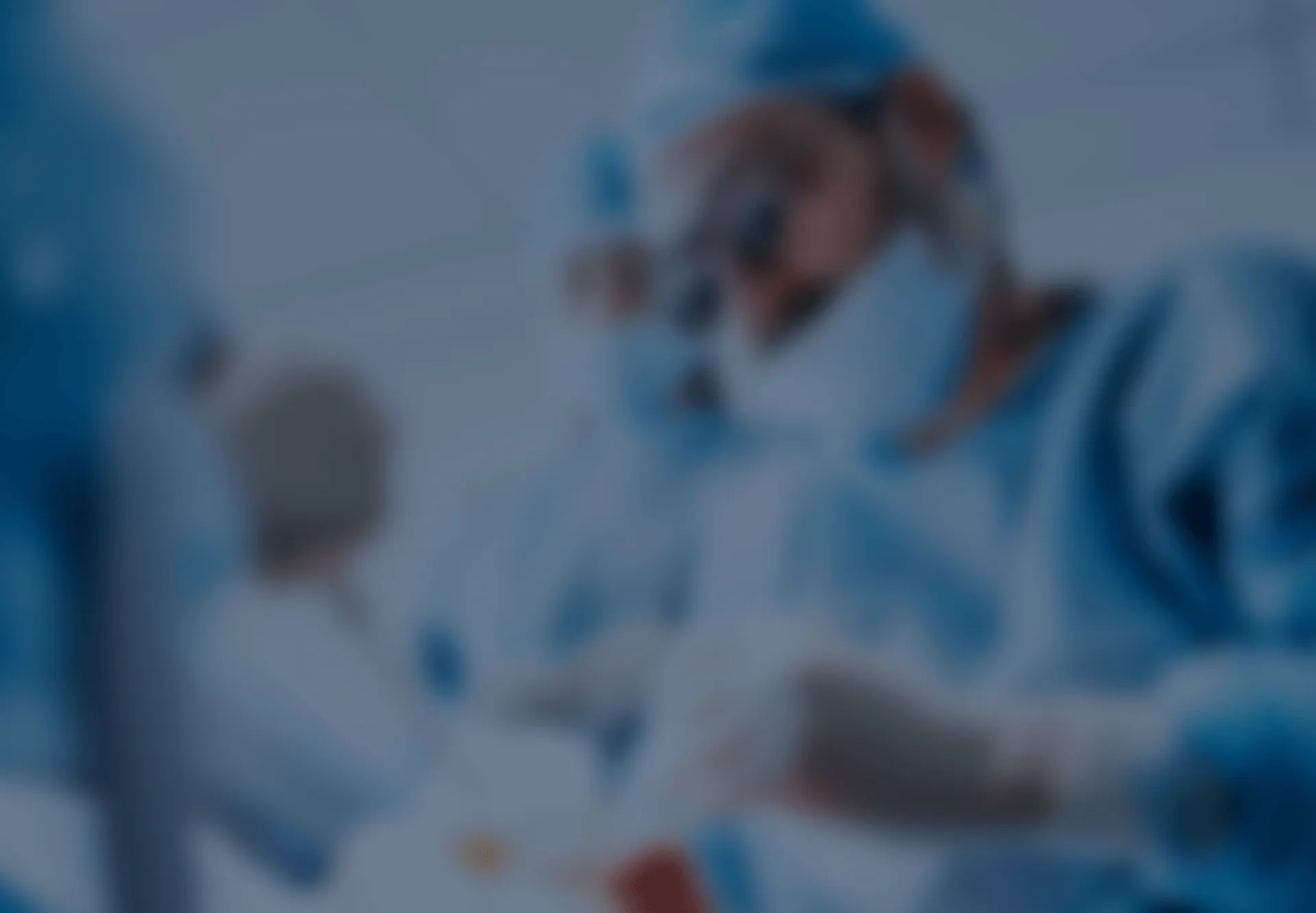 A blurred pictue of dentist performing a procedure.