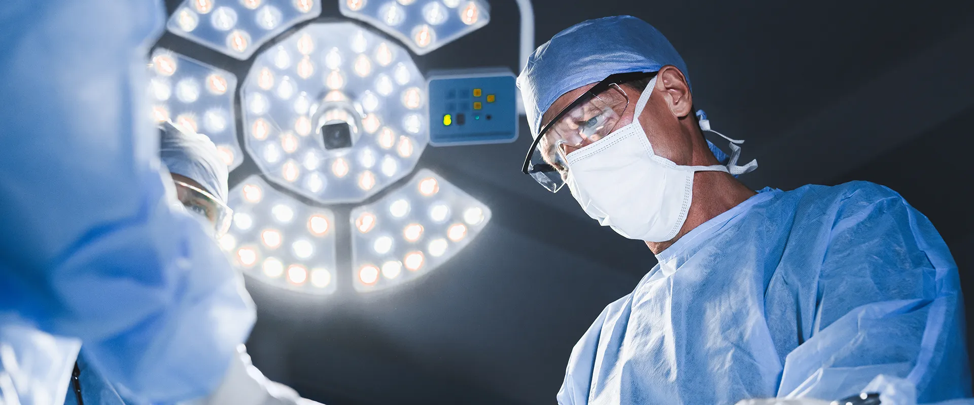 Doctors working in a treatment or operating room.