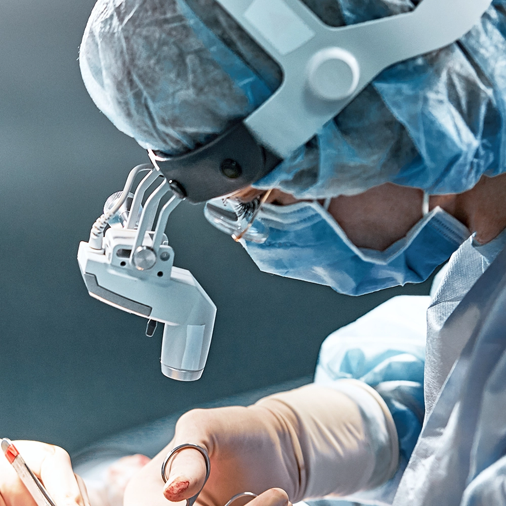 Doctors working in a treatment or operating room.