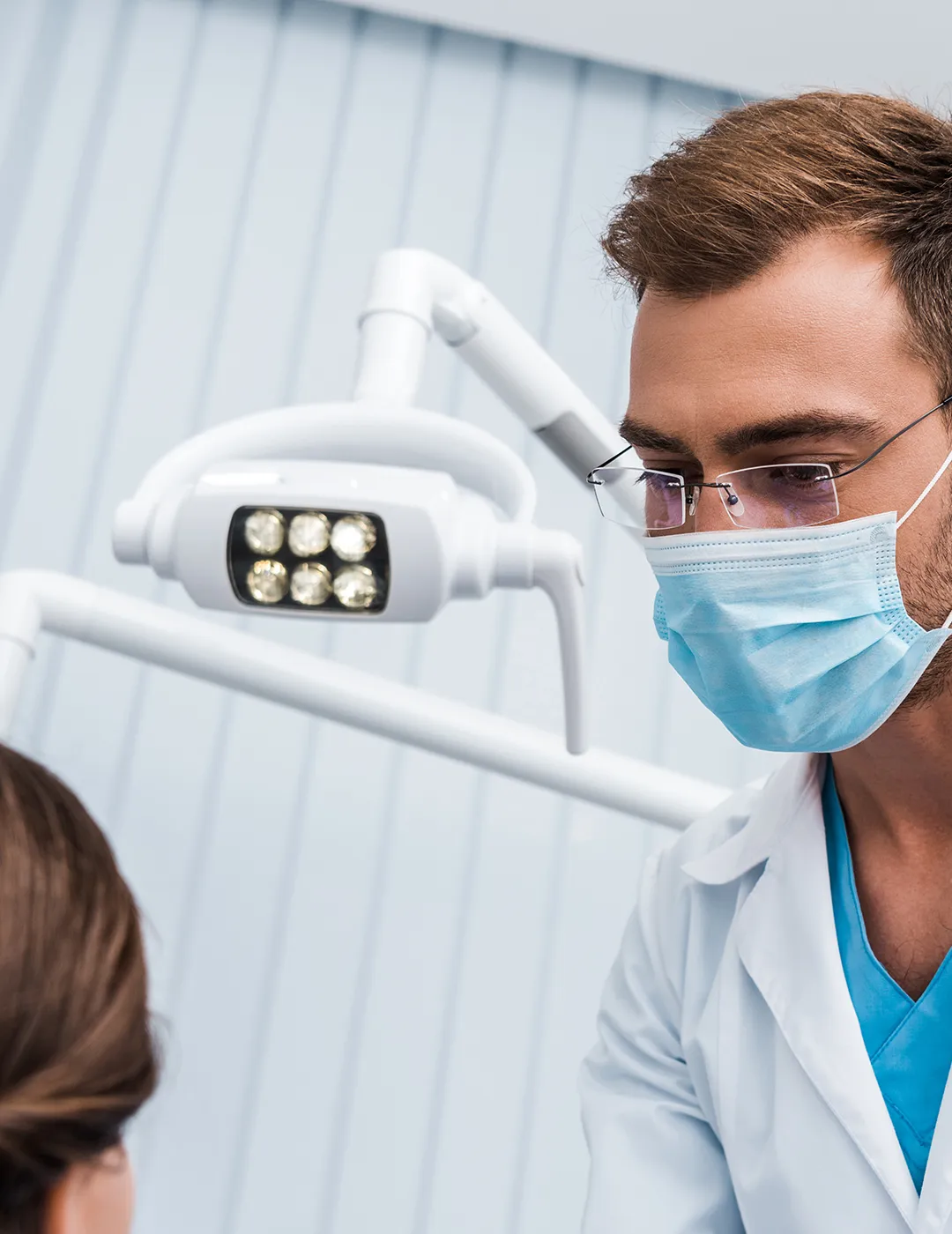 A dentist assessing a patient.