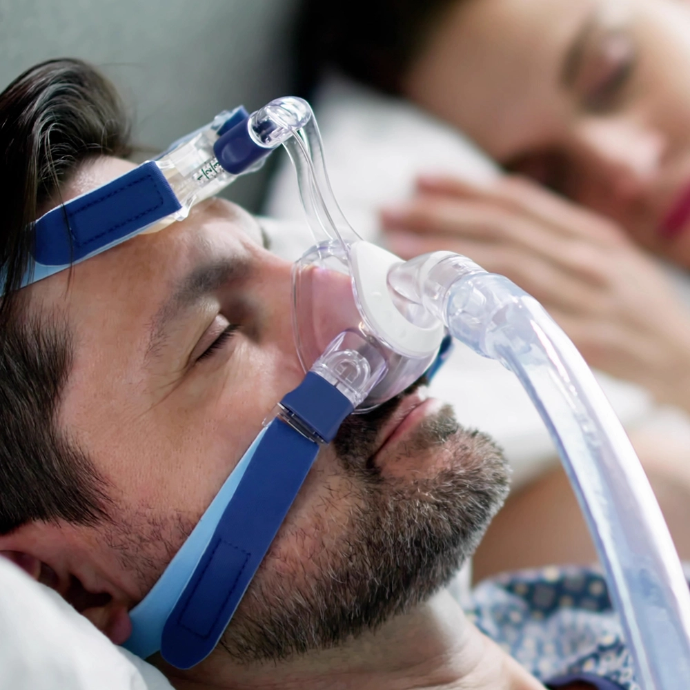 Man sleeping with a mask to address sleep difficulties.