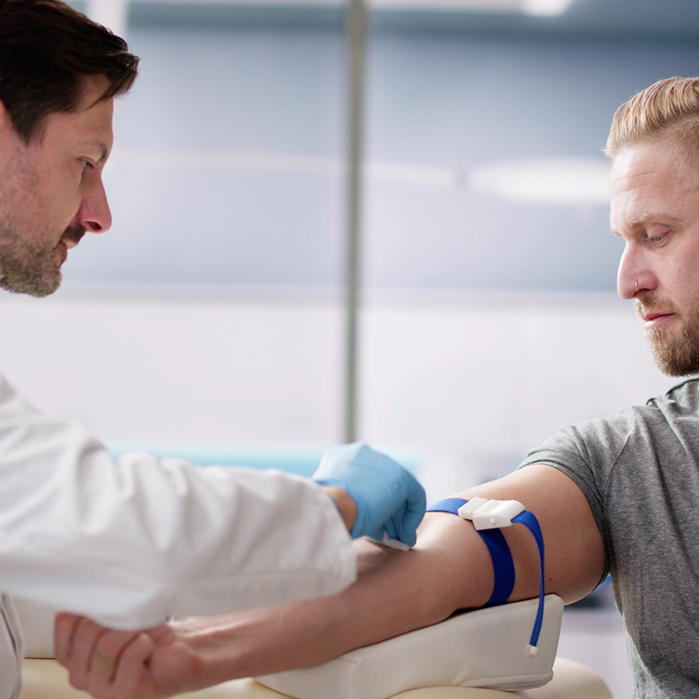 Man preparing to have plasma extracted.